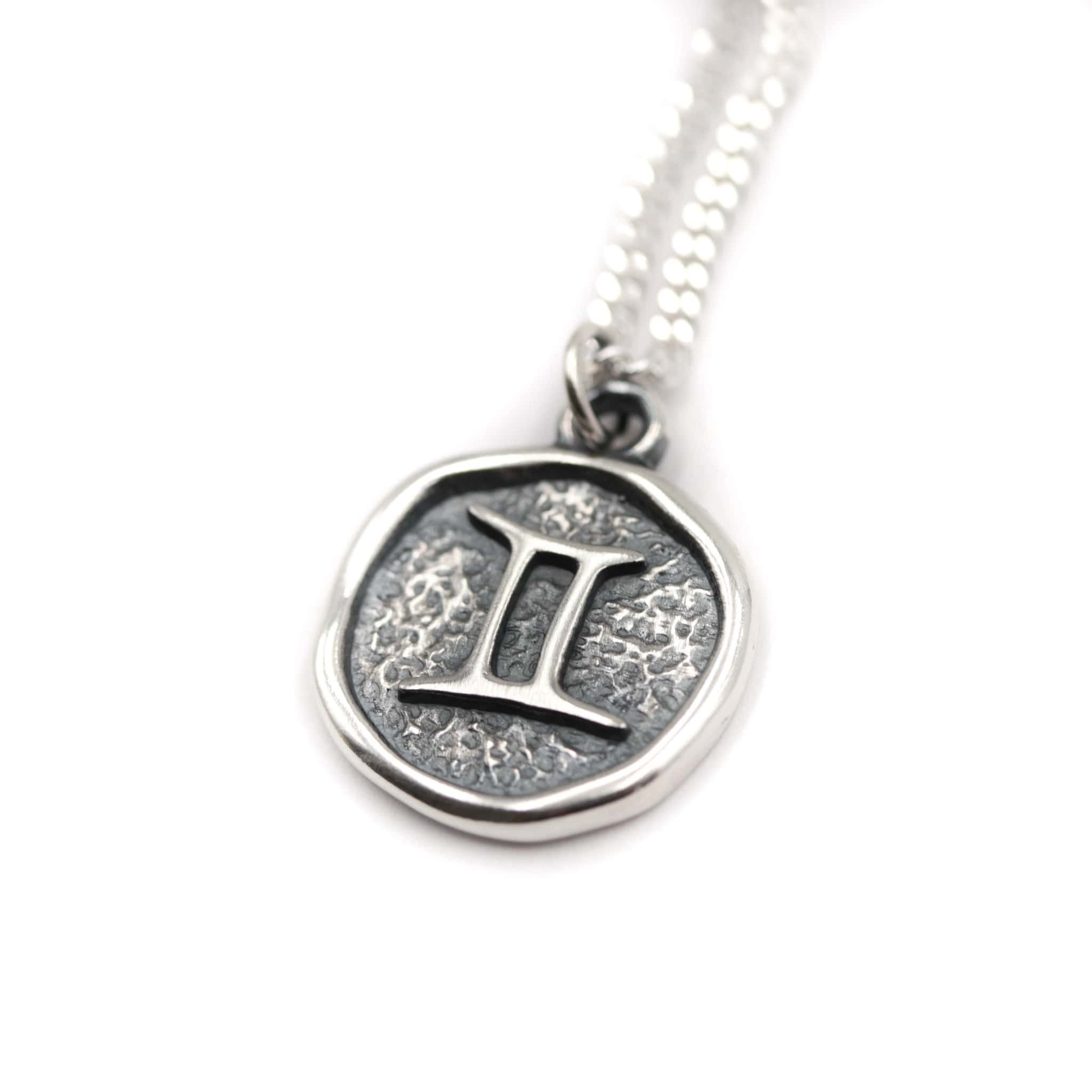 Sterling silver gemini on sale pendant